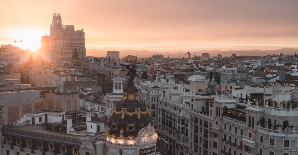 Stunning view of Madrid cityscape with sunset over the Metropolis Building.